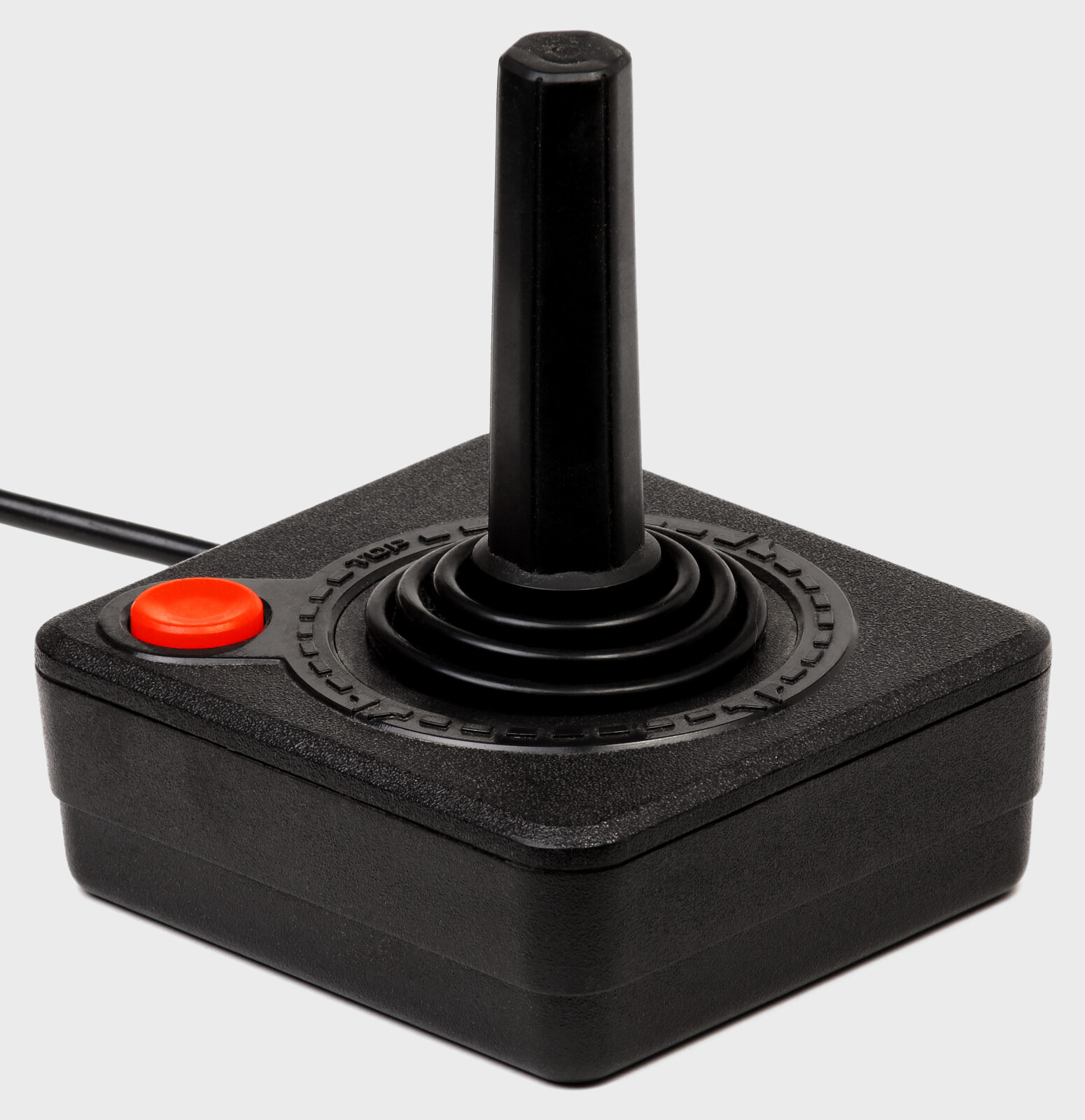 Atari CX40 joystick, black square base, red fire button at top left, orange TOP ring around the stick