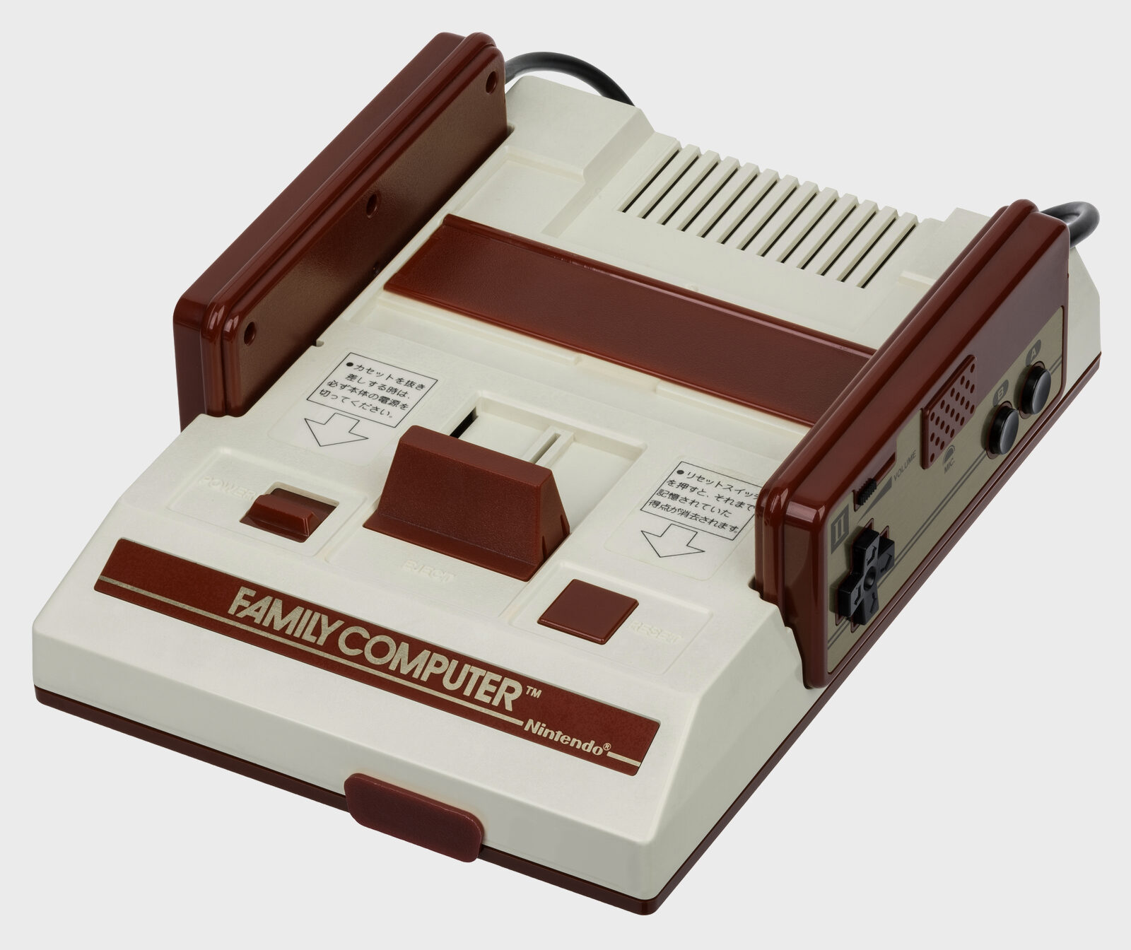 Original Japanese Family Computer, cream case with dark red trim, top-loading slot, controller II docked on the right